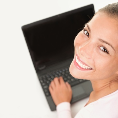 smiling student at laptop